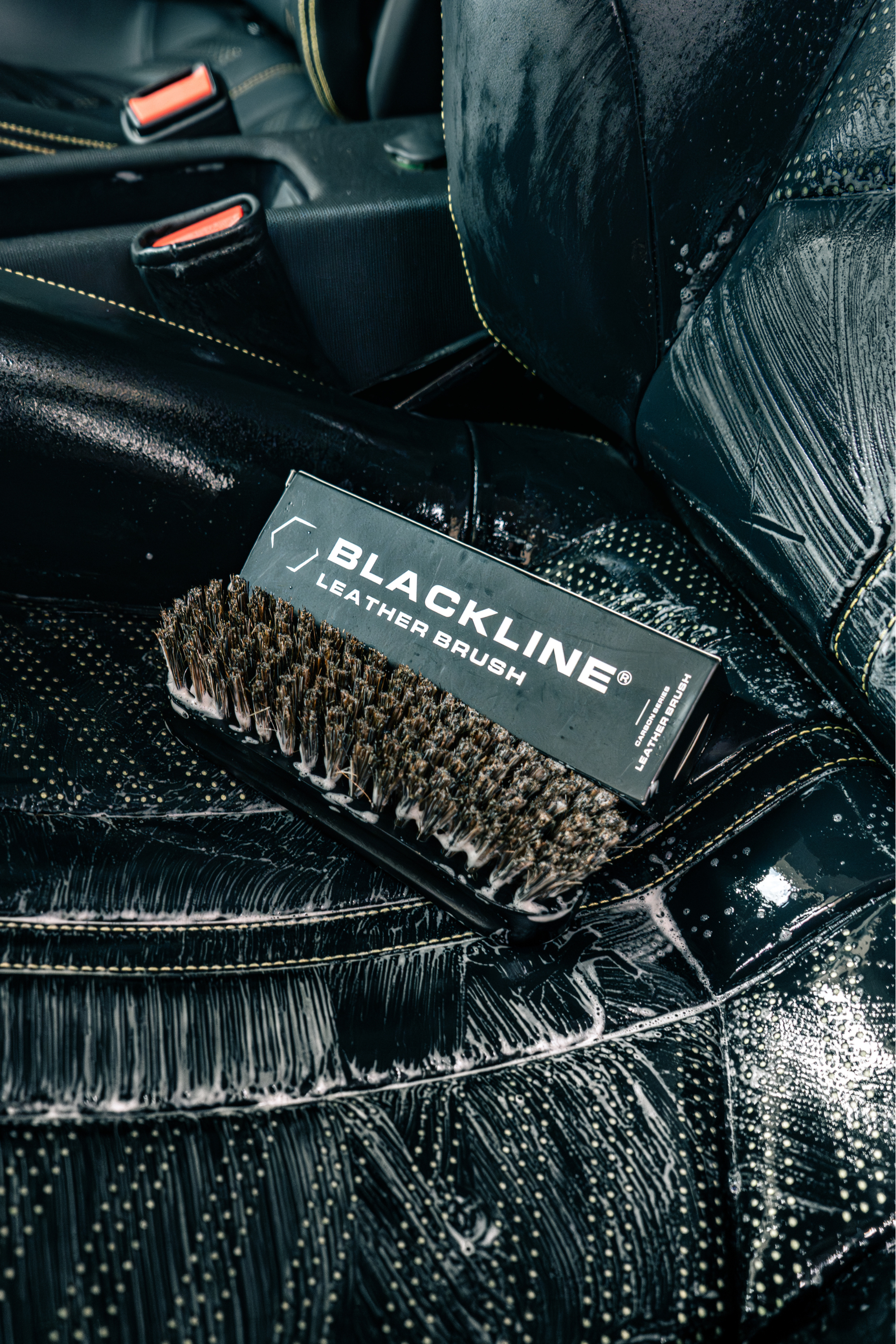 Blackline Car Care BLACKLINE® LEATHER BRUSH in use - professional detailing application