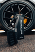 Blackline Car Care BLACKLINE® STIFF BRISTLE TIRE BRUSH in use - professional detailing application