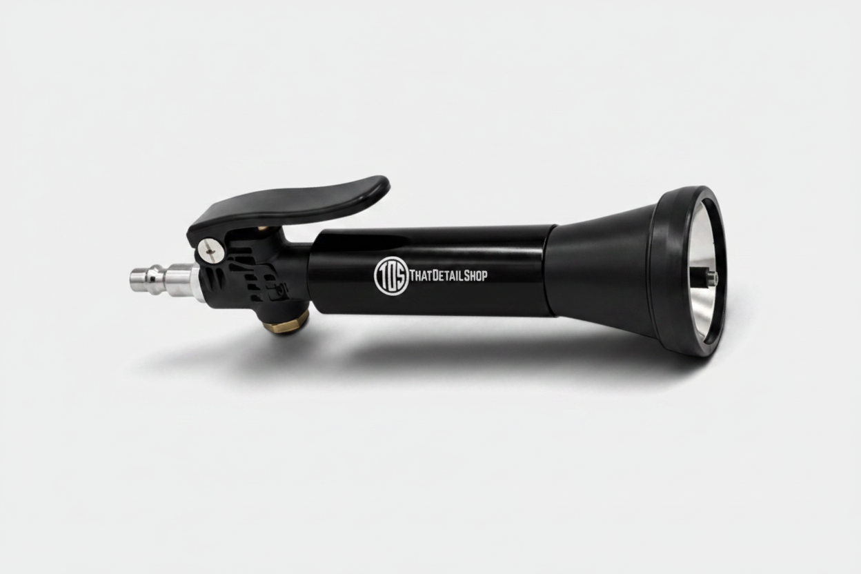 A black spray gun attachment with a black trigger handle and a silver nozzle, featuring the 'TIG DETAIL SHIP' logo on the barrel, set against a plain white background.