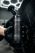 Blackline Car Care BLACKLINE® BLACKOUT TRIM & TIRE DRESSING in use - professional detailing application
