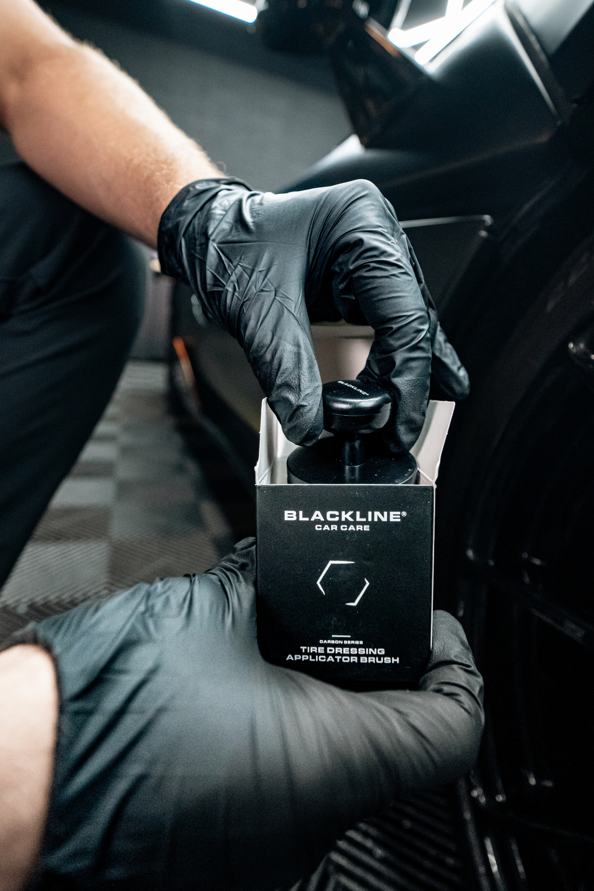 Blackline Car Care BLACKLINE® TIRE APPLICATOR BRUSH in use - professional detailing application