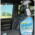That Detail Shop Bio-Bombs Squash LLC air freshener spray bottle sitting on a car seat for a fresh interior finish.