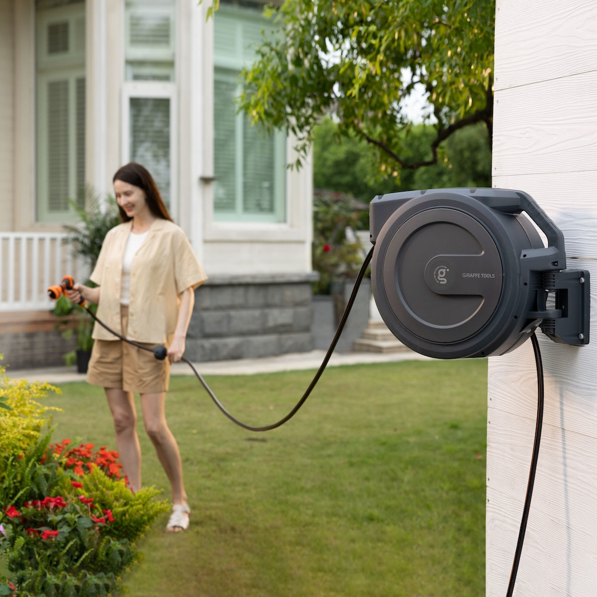 Giraffe Tools retractable garden hose reel delivers a one-stop watering solution—wall-mounted, auto-rewind, and adjustable for effortless use.