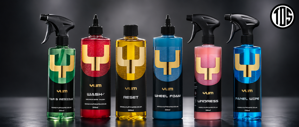 Set of automotive care products with colorful labels on a dark background