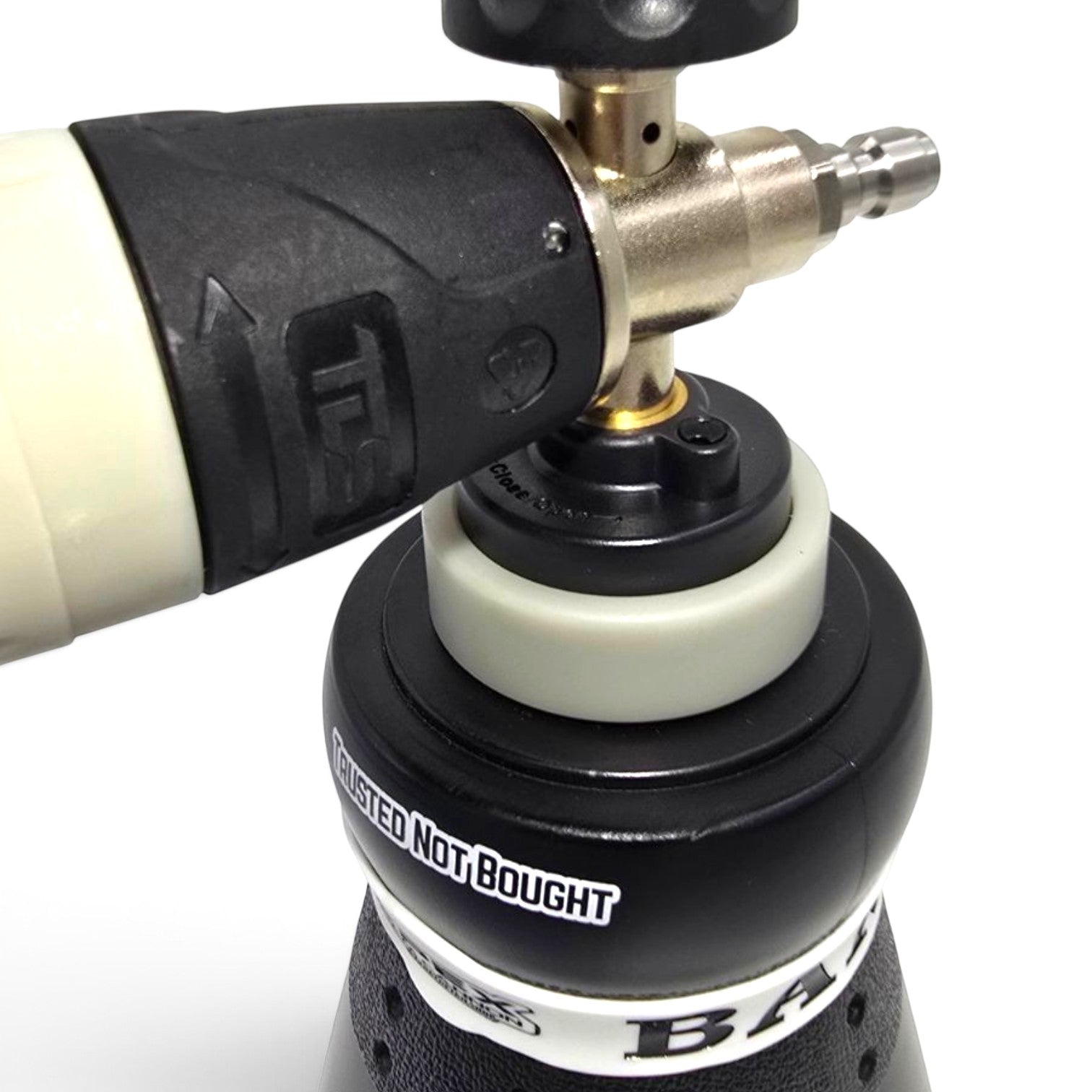 That Detail Shop Apex Foam Cannon featuring a black and cream design with a brass quick-connect fitting for car washing.