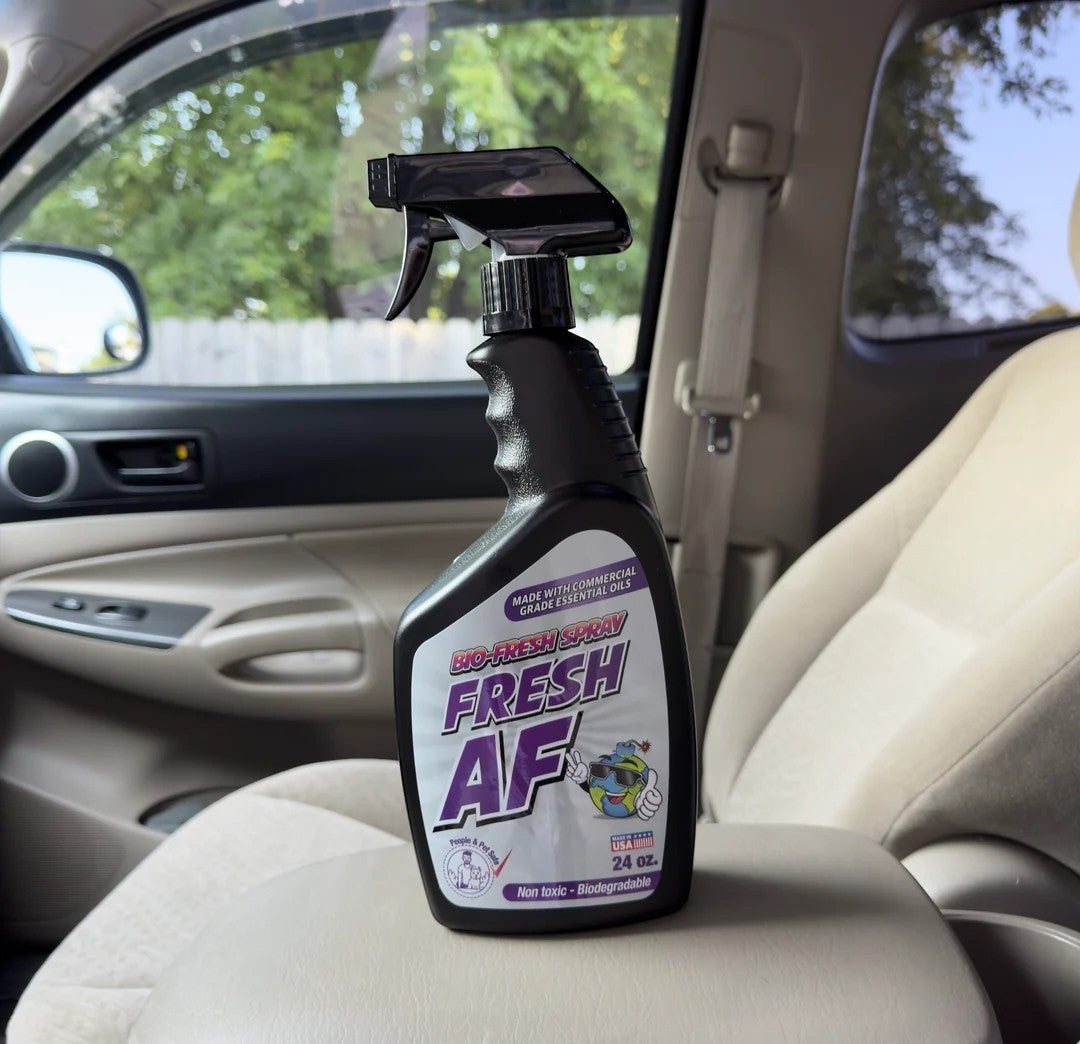 That Detail Shop Bio-Bombs Fresh AF air freshener spray bottle on car seat. Made with commercial grade essential oils.