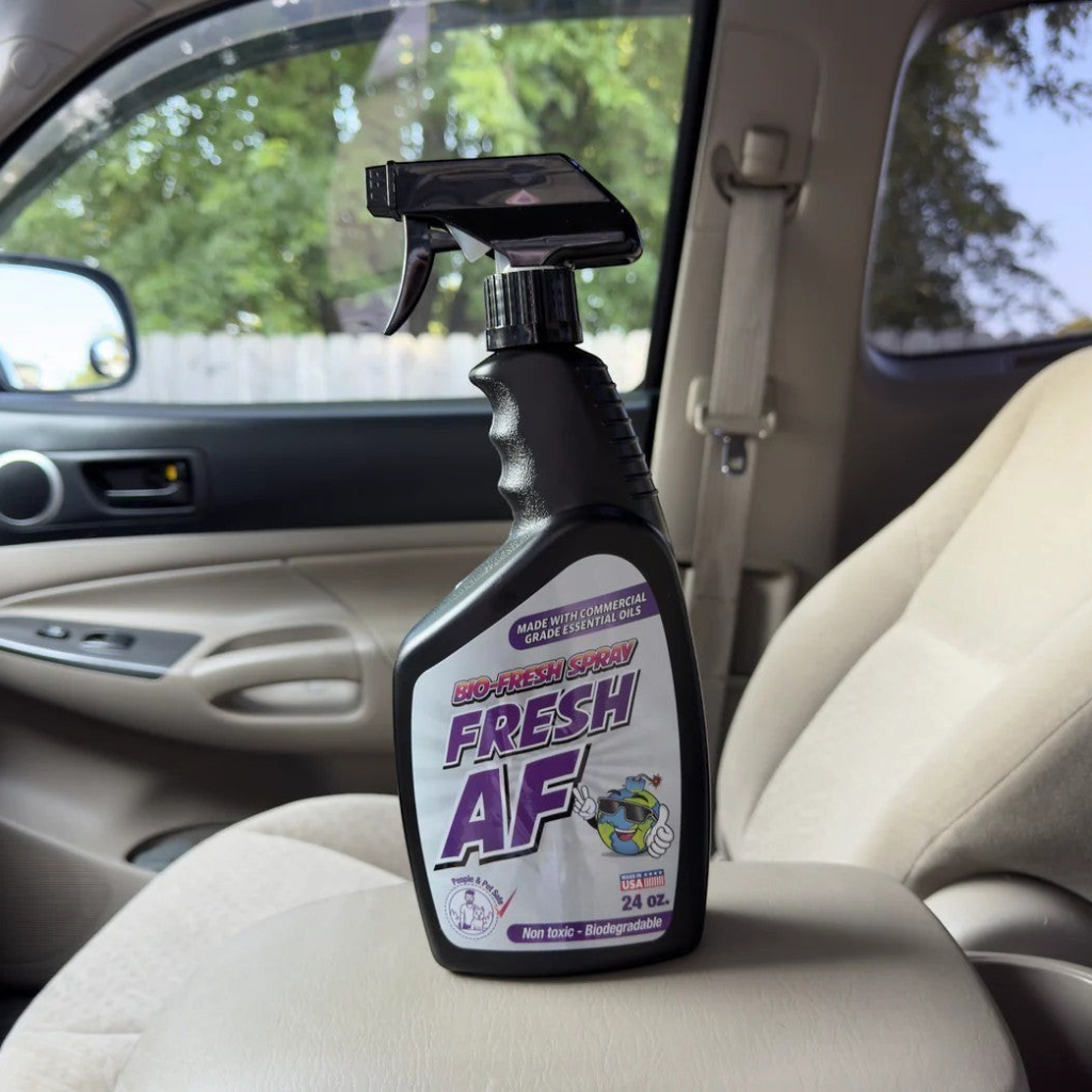 That Detail Shop Bio-Bombs Fresh AF air freshener spray bottle on car seat. Made with commercial grade essential oils.