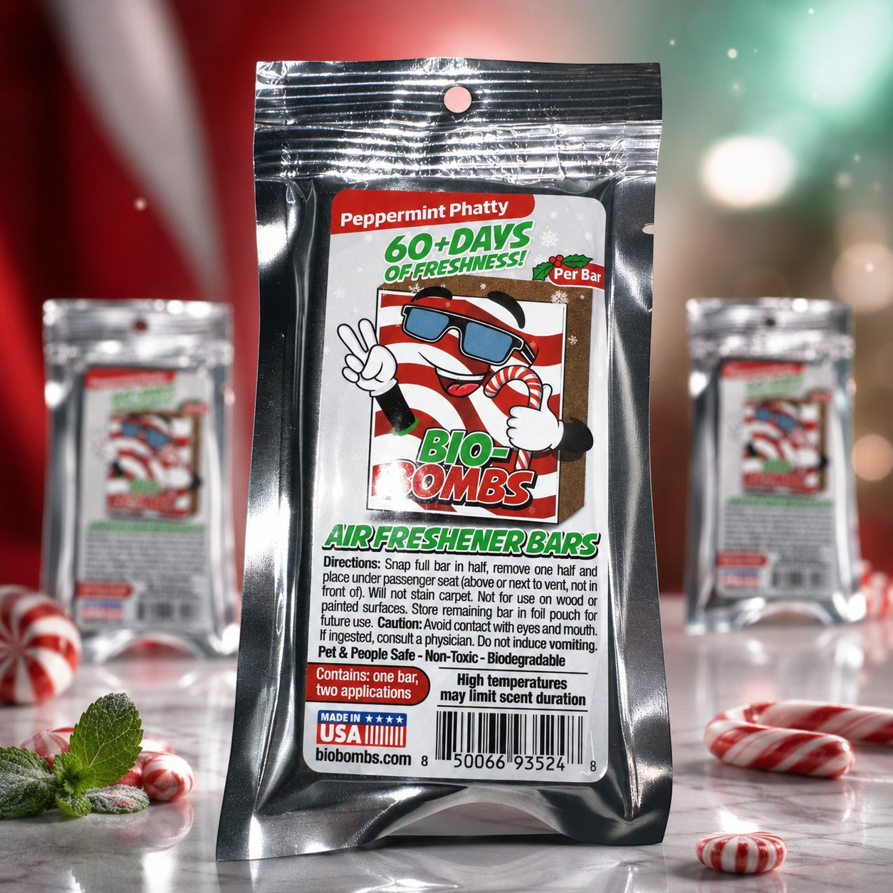 That Detail Shop Bio-Bombs Peppermint Phatty air freshener bar with 60+ days of freshness. Features a cartoon character with sunglasses holding a candy cane.