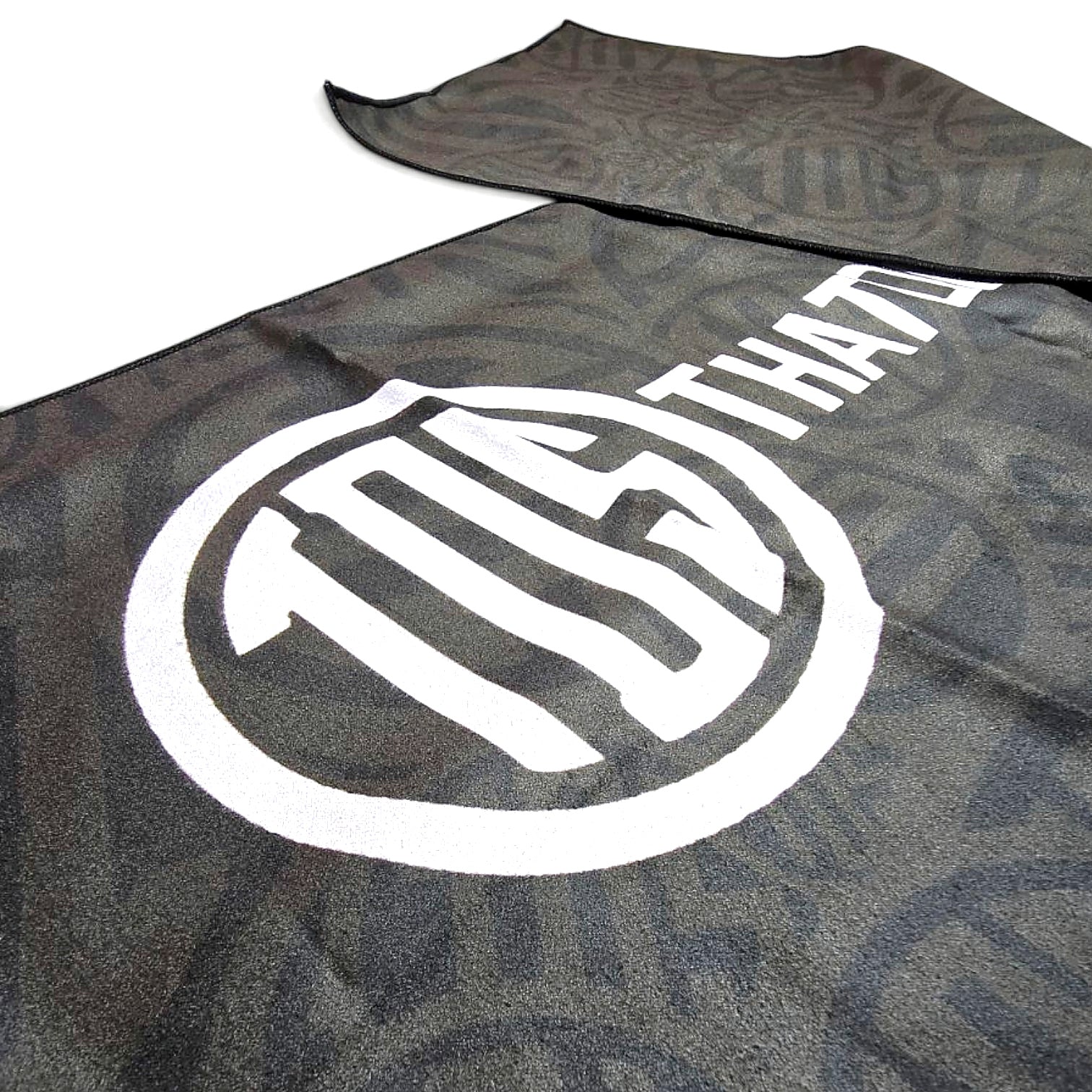 That Detail Shop black heavyweight cooling towel with white TDS logo, designed for evaporative heat relief.