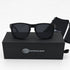 That Detail Shop polarized sunglasses in matte black with a square frame, displayed on their branded storage box.