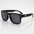 That Detail Shop matte black polarized sunglasses with a classic square frame and subtle TDS logo on the temple.