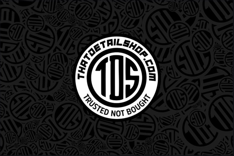 That Detail Shop Blackout PVC banner featuring a dark patterned background with a central white TDS logo badge.