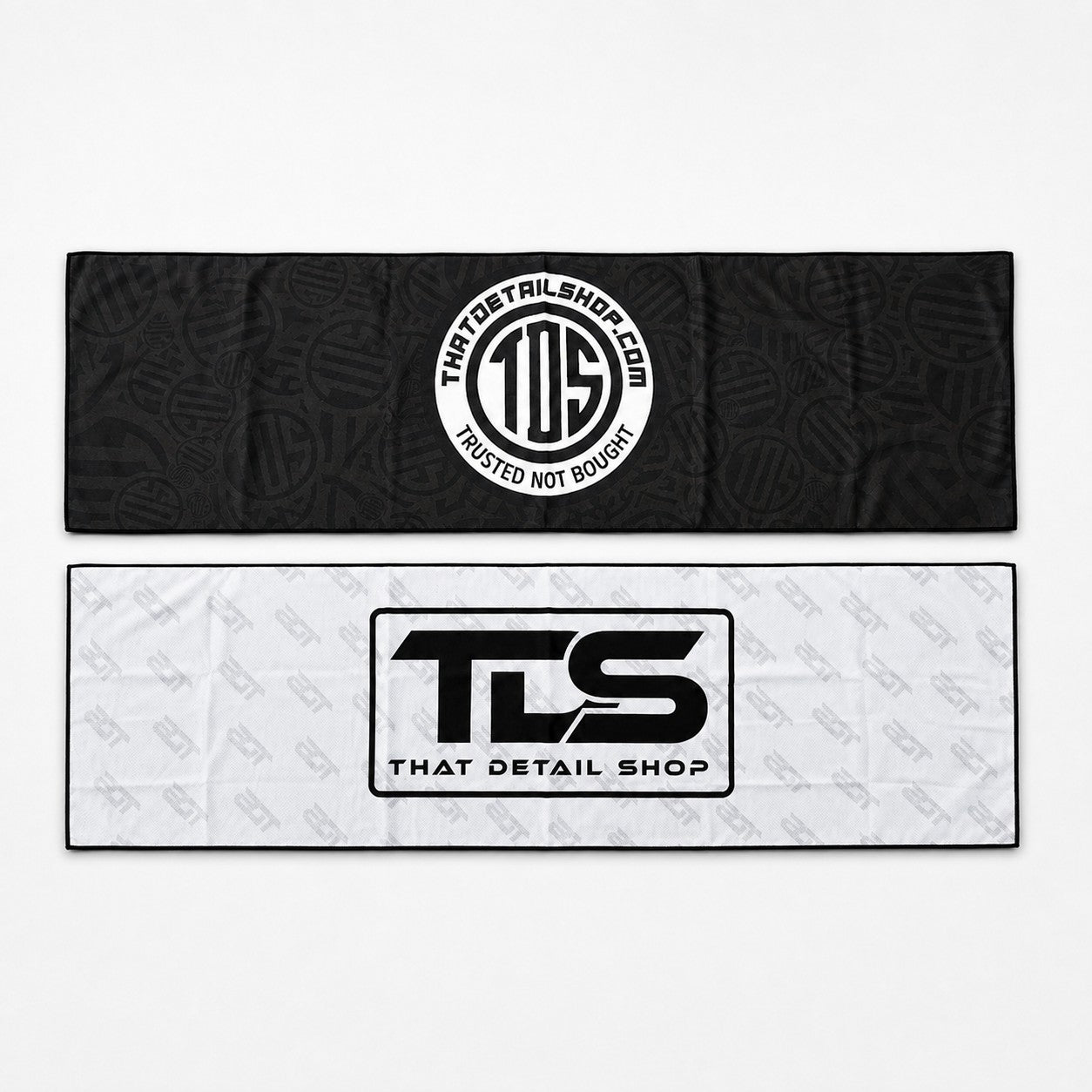 That Detail Shop Cooley cooling towels in black heavyweight and white lightweight versions with branded logos.