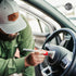 That Detail Shop detailing brush cleaning a car's steering wheel with soft bristles.