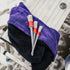That Detail Shop detailing brushes set with ultra-soft bristles and red accents on purple and black microfiber towels.