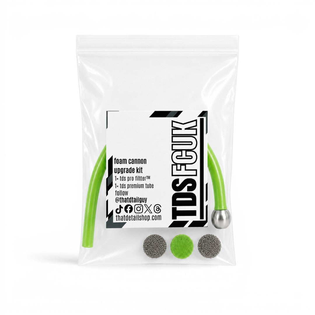 That Detail Shop FCUK foam cannon upgrade kit in a clear plastic bag with green tubing, metal filter, and mesh discs.