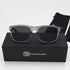 That Detail Shop polarized sunglasses with frost gray square frames and dark lenses, displayed on a branded box.