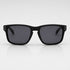 That Detail Shop polarized sunglasses with a matte black square frame and dark lenses on a light background