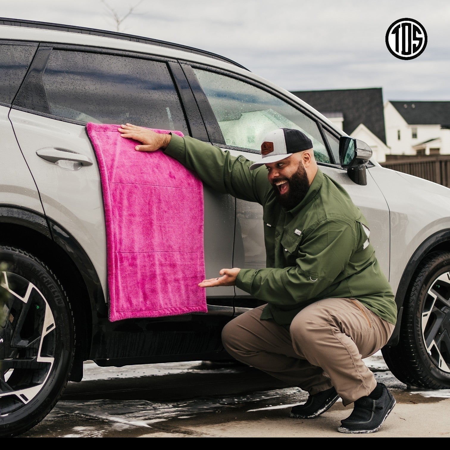 That Detail Shop pink and gray microfiber drying towel on a car door. 1400 GSM twisted-loop weave.