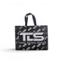 That Detail Shop reusable black tote bag featuring a bold white TDS logo and repeating pattern on a white background.