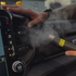 That Detail Shop professional using a steam cleaner on a car air vent to remove odors and debris