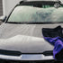 That Detail Shop TDS 1600 DT drying towel in black and purple microfiber on a wet car hood.