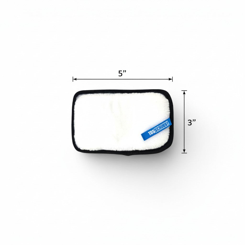 That Detail Shop TDS Scrubby interior cleaning sponge with white scrub surface and blue TDS Scrubby tag.