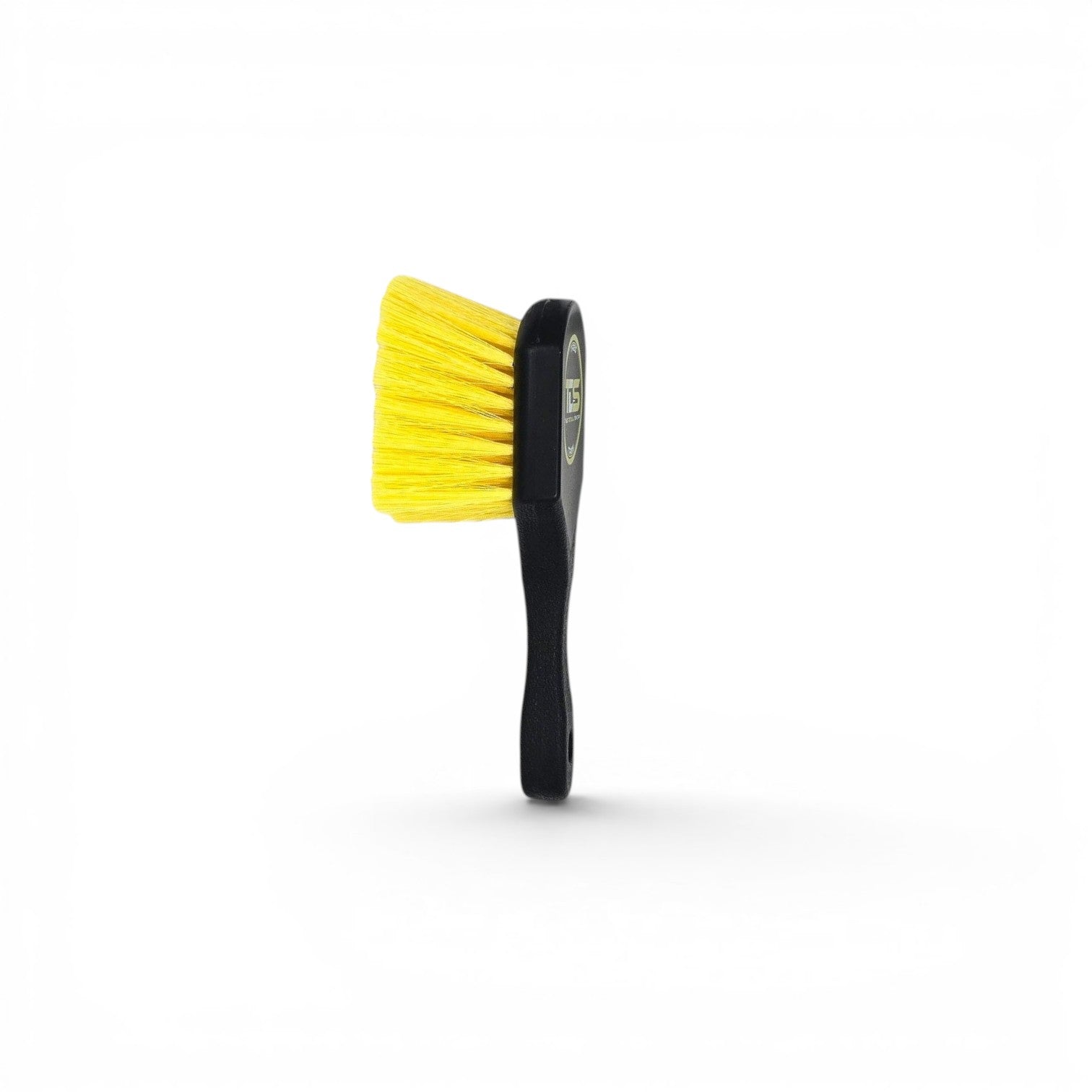 That Detail Shop TDS Tire Brush with black handle and bright yellow bristles for cleaning wheels and tires.