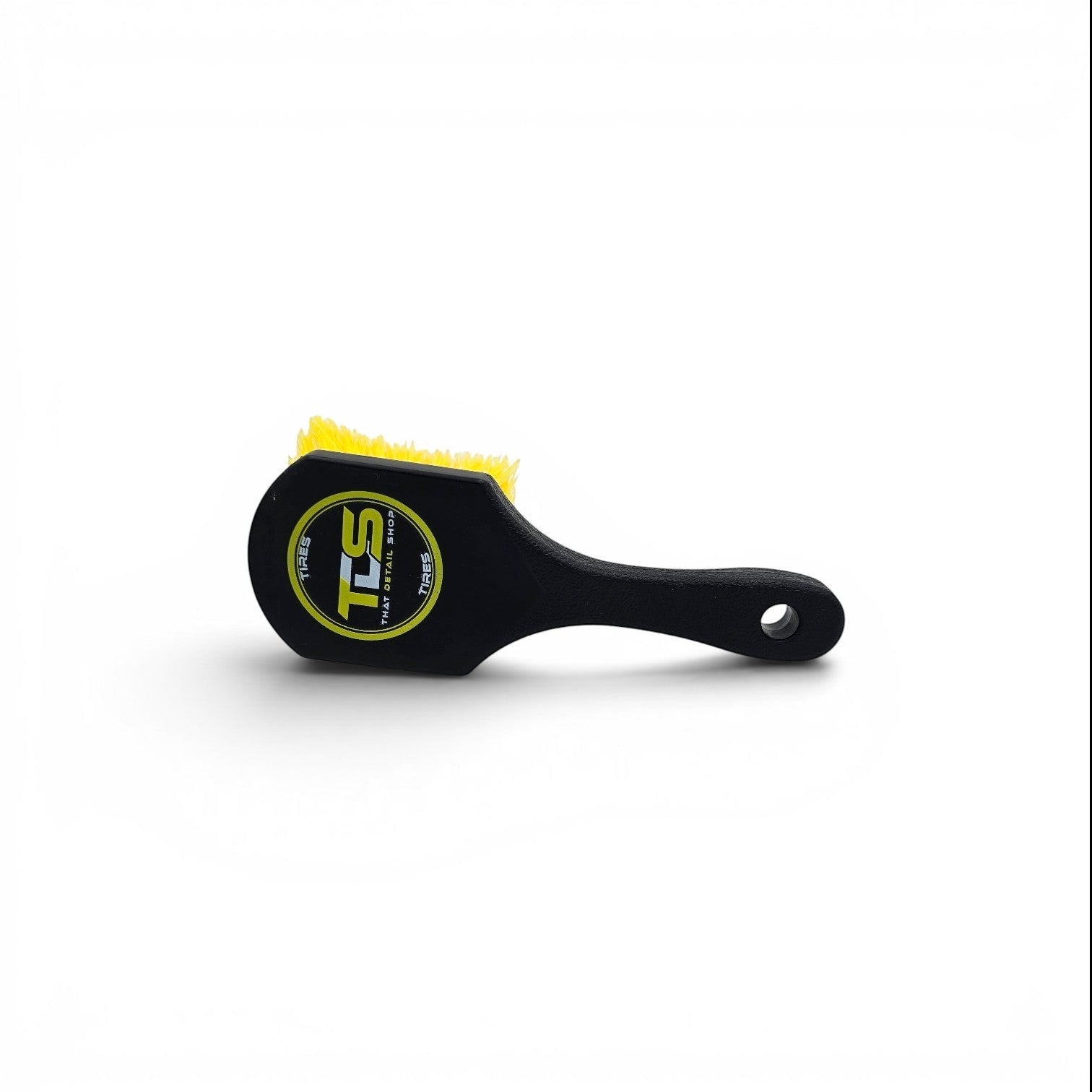 That Detail Shop black tire brush with yellow bristles and a logo on the head.
