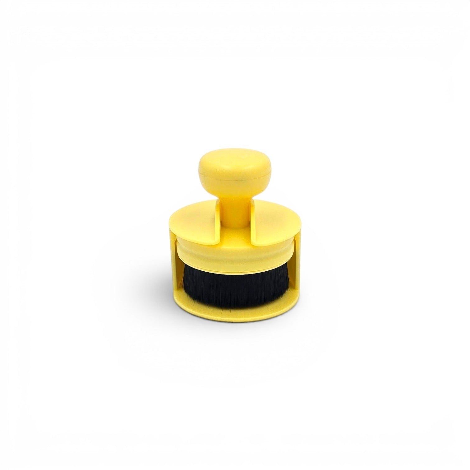 That Detail Shop yellow tire shine applicator brush with black bristles and ergonomic handle.