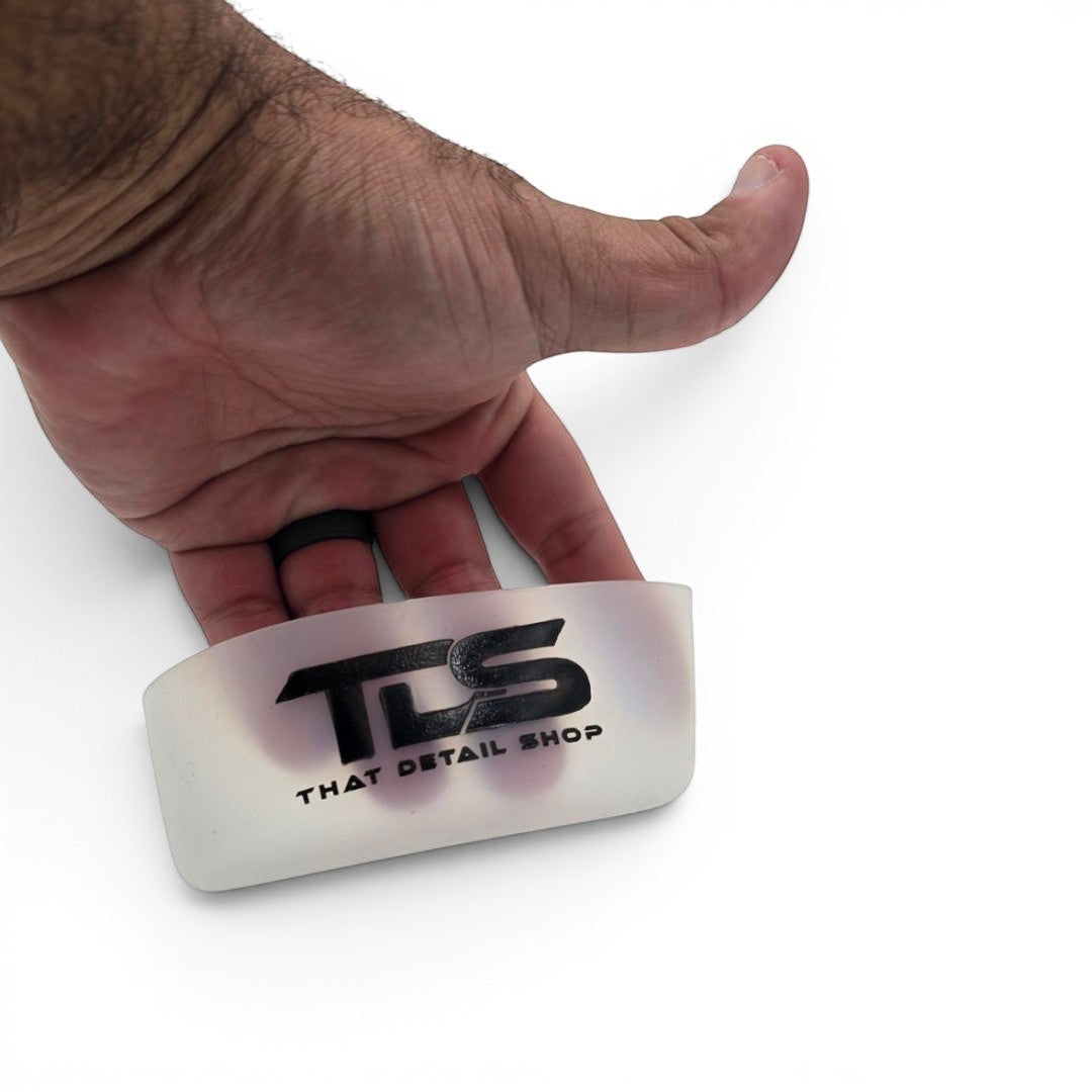 That Detail Shop TDS Welly translucent silicone bumper with black logo held in a hand for scale