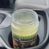 That Detail Shop Bio-Bombs vehicle deodorization kit activating in a car cup holder with visible vapor