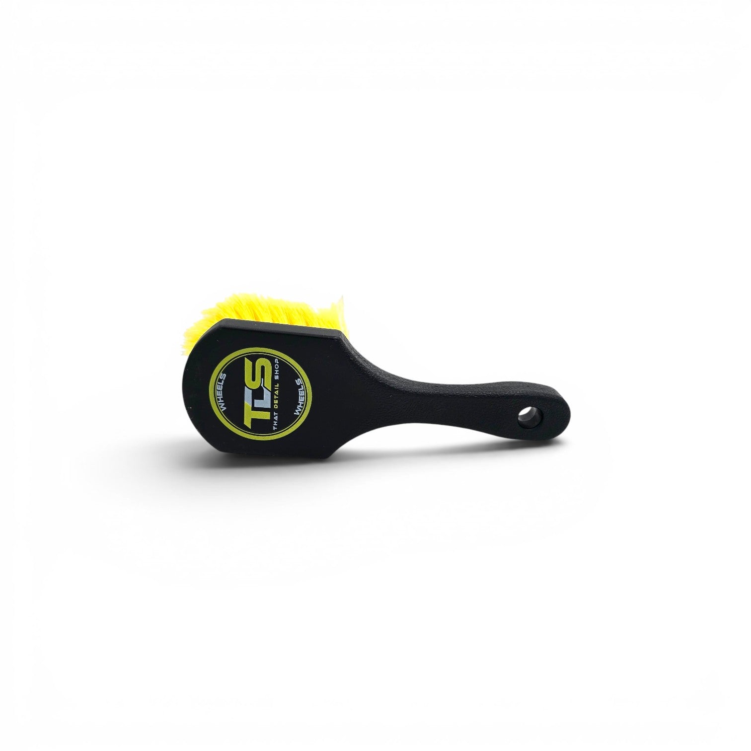 That Detail Shop black wheel brush with yellow bristles and ergonomic handle for cleaning wheels and tires.
