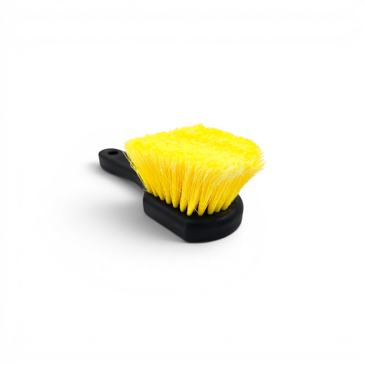That Detail Shop yellow and black wheel brush for cleaning brake dust and road grime from wheels and tires.