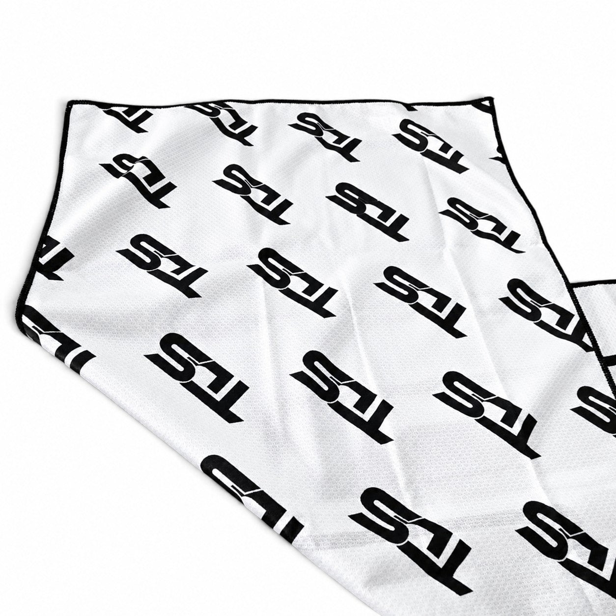 That Detail Shop white lightweight cooling towel with black TDS logo pattern for heat relief during detailing work.