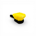 That Detail Shop black and yellow tire brush with stiff bristles for cleaning tire sidewalls.
