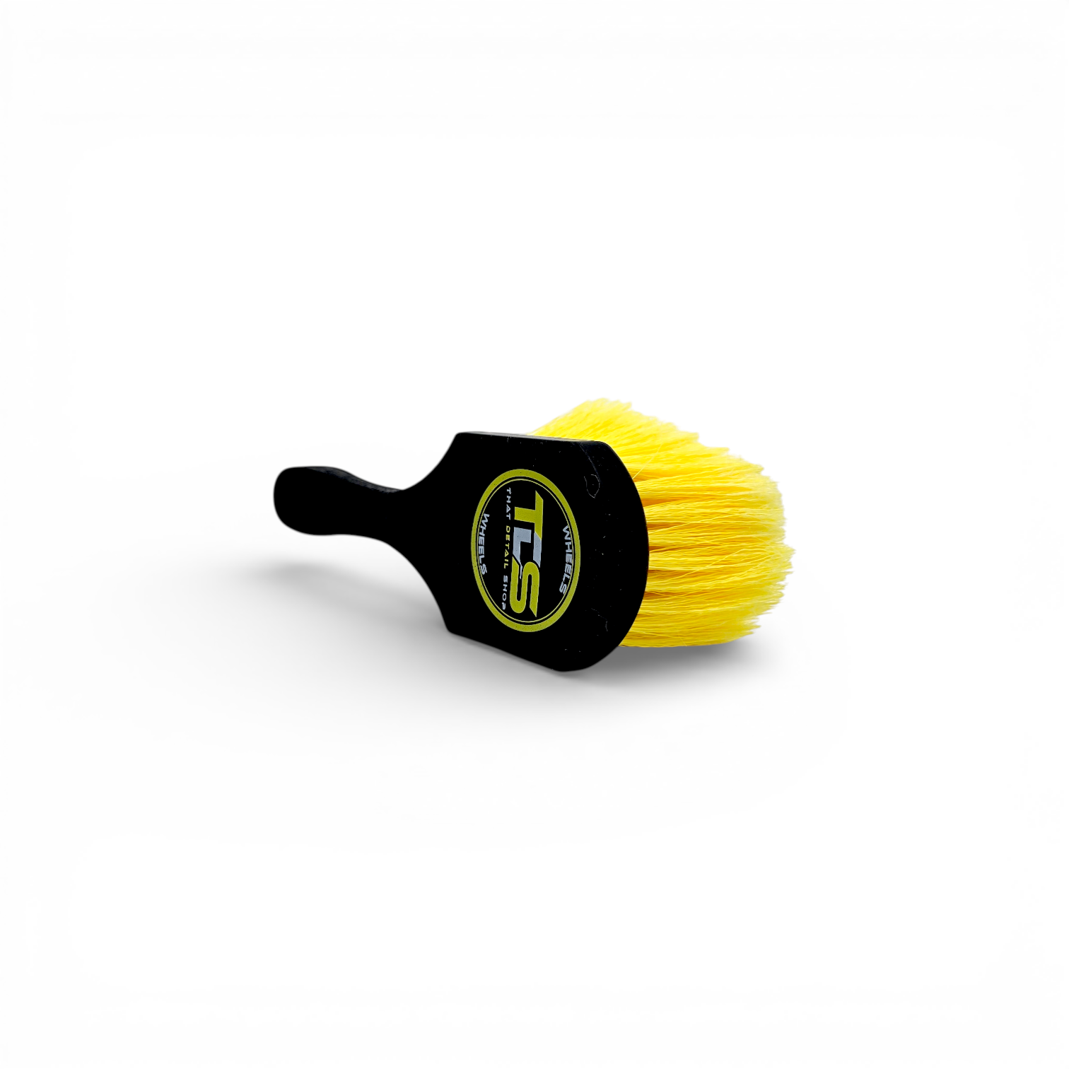 That Detail Shop black and yellow tire brush with stiff bristles for cleaning tire sidewalls.