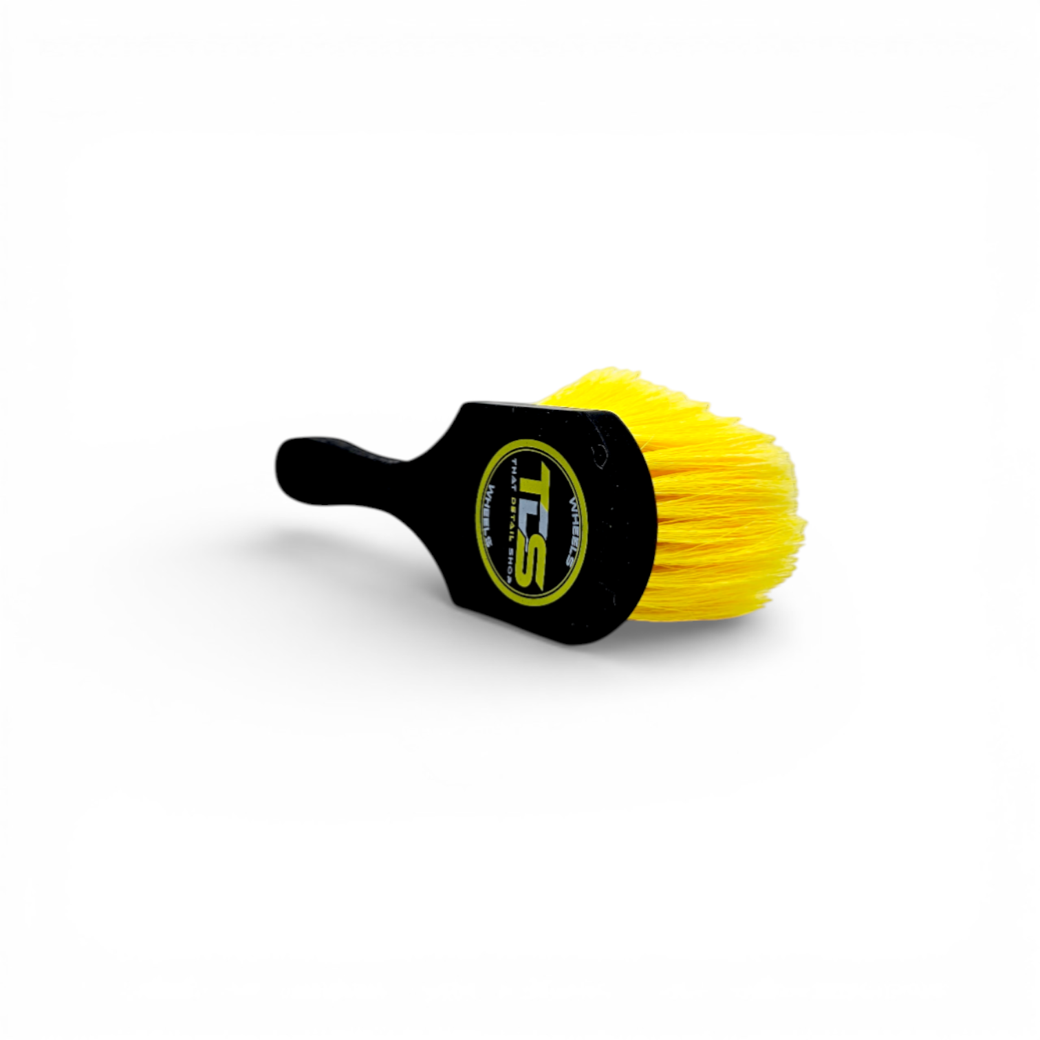 That Detail Shop black and yellow wheel brush with firm synthetic bristles for cleaning brake dust and grime.
