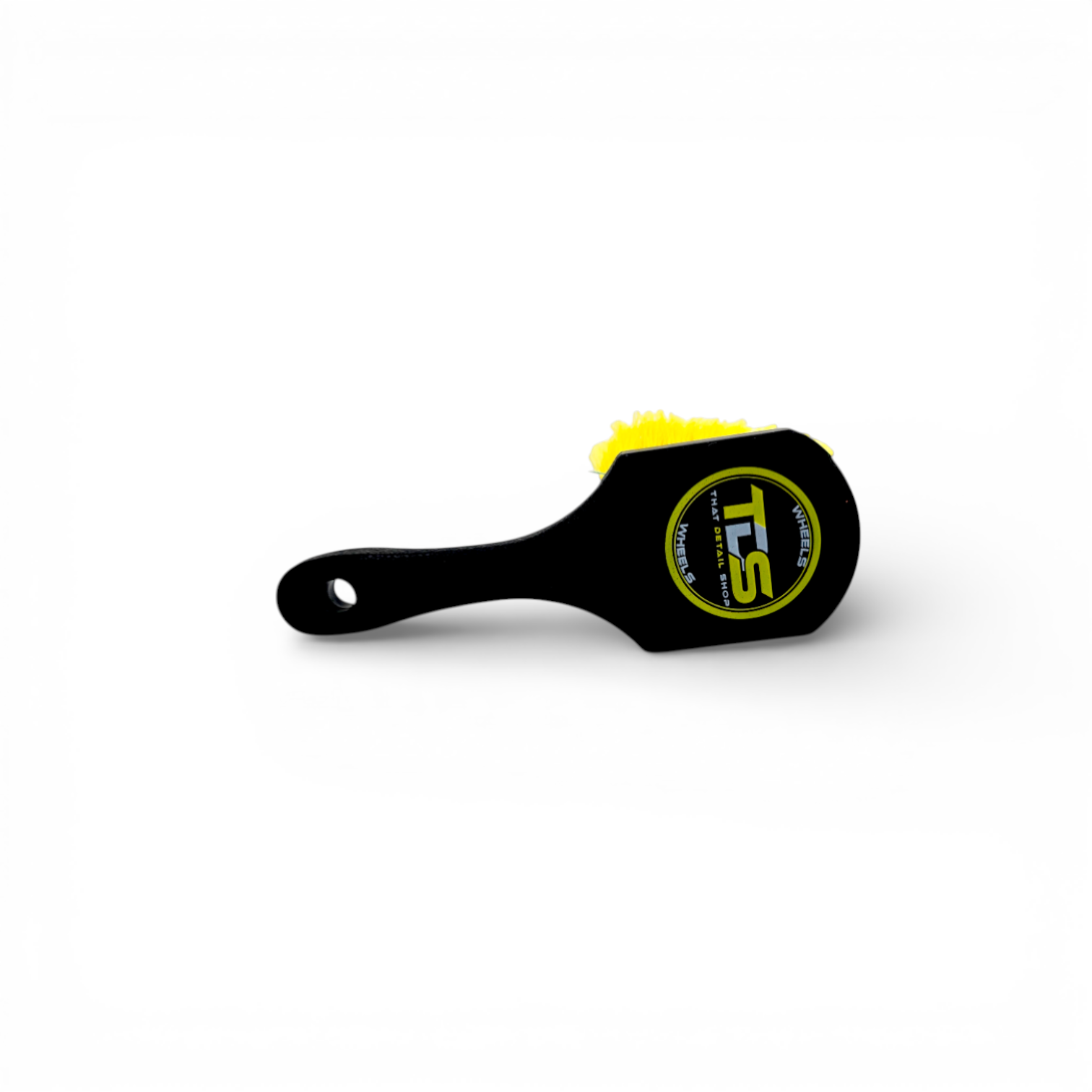 That Detail Shop black and yellow wheel brush with firm synthetic bristles for cleaning brake dust and grime.