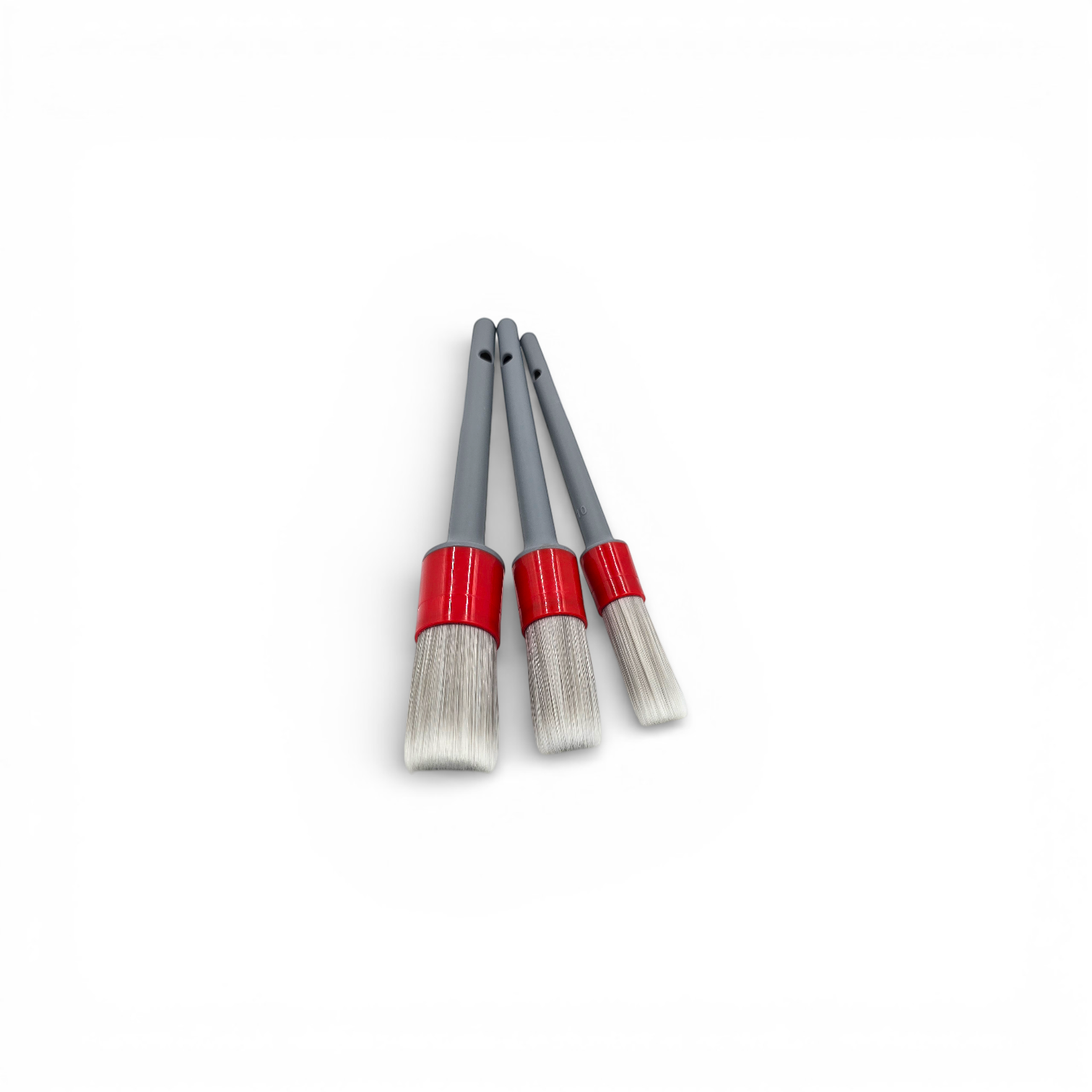 That Detail Shop set of 3 interior detailing brushes with soft synthetic bristles and red and grey handles.