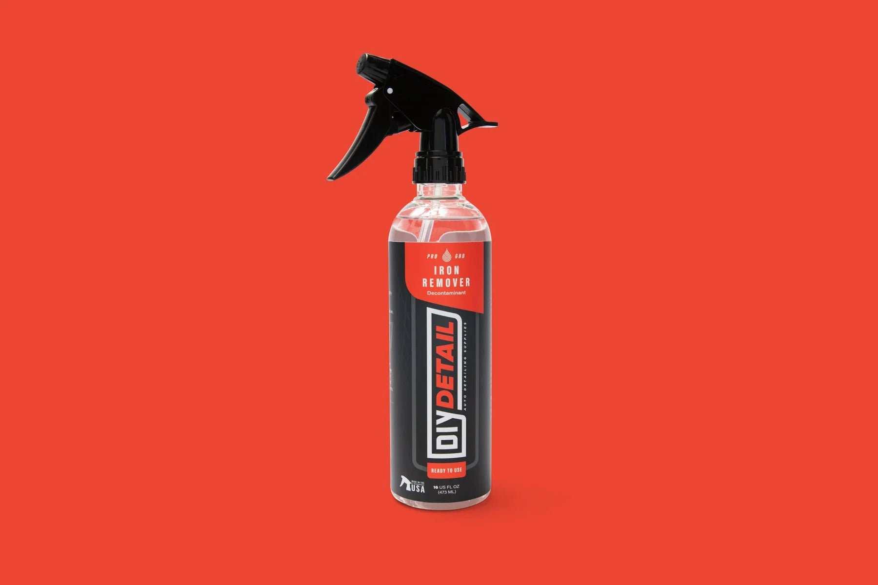 Car care product spray bottle with red background